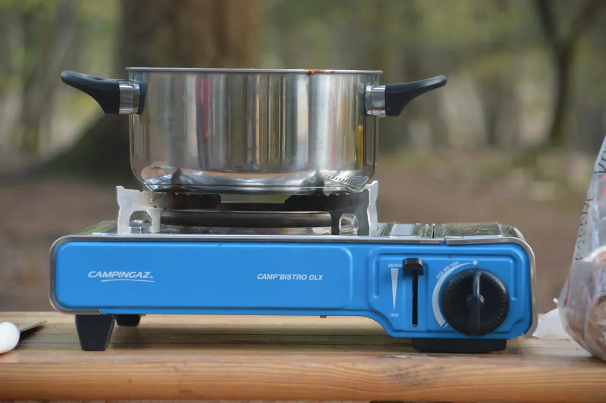 stainless steel coffee pot on blue and silver coffee maker
